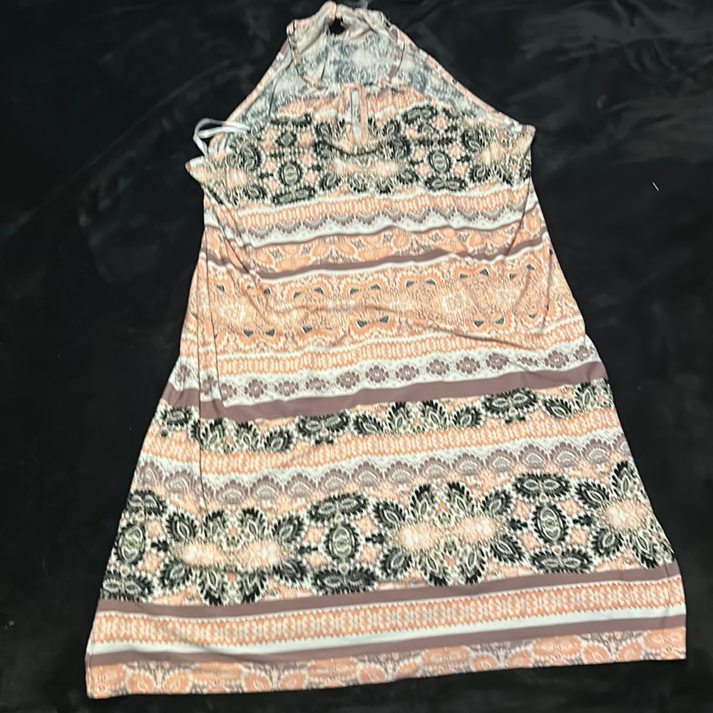 Pink, brown, cream and black. Pattern strap dress. In very good condition.